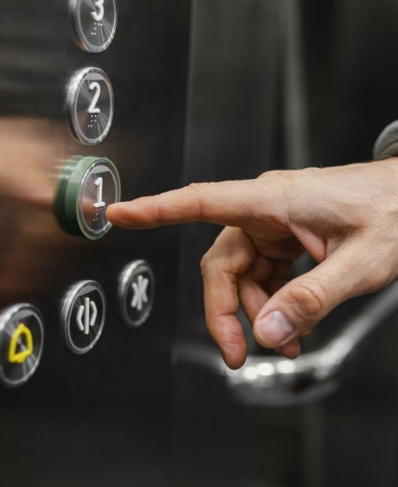 delivery-man-with-package-elevator-close-up